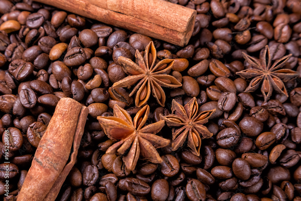 Fototapeta Coffee beans and cinnamon on a background of burlap. ,