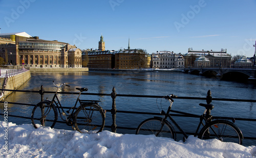 Parliament houses in Stockholm a cold winter day with iceflakes floating bye on the river Strömmen