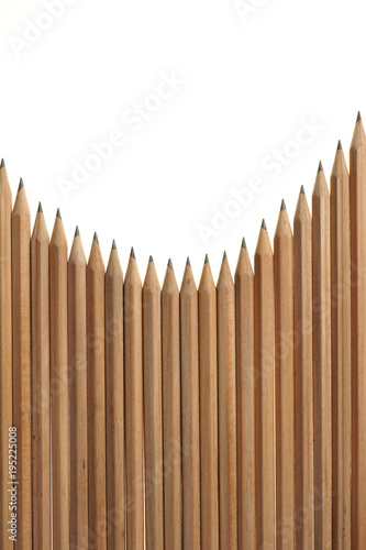 Bunch of identical graphite pencils on white background