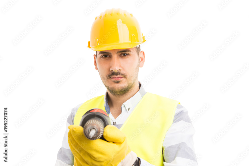 Attractive young builder or constructor holding drilling machine. Attractive young builder or constructor holding drilling machine.
