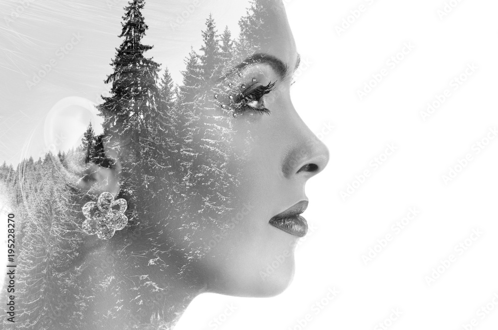 Double exposure of beautiful woman and trees covered with snow Double exposure of beautiful woman and trees covered with snow