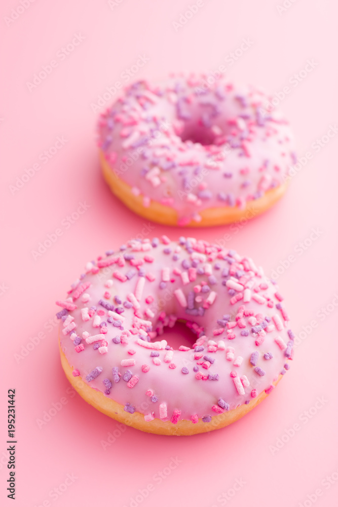 Two pink donuts. Two pink donuts.