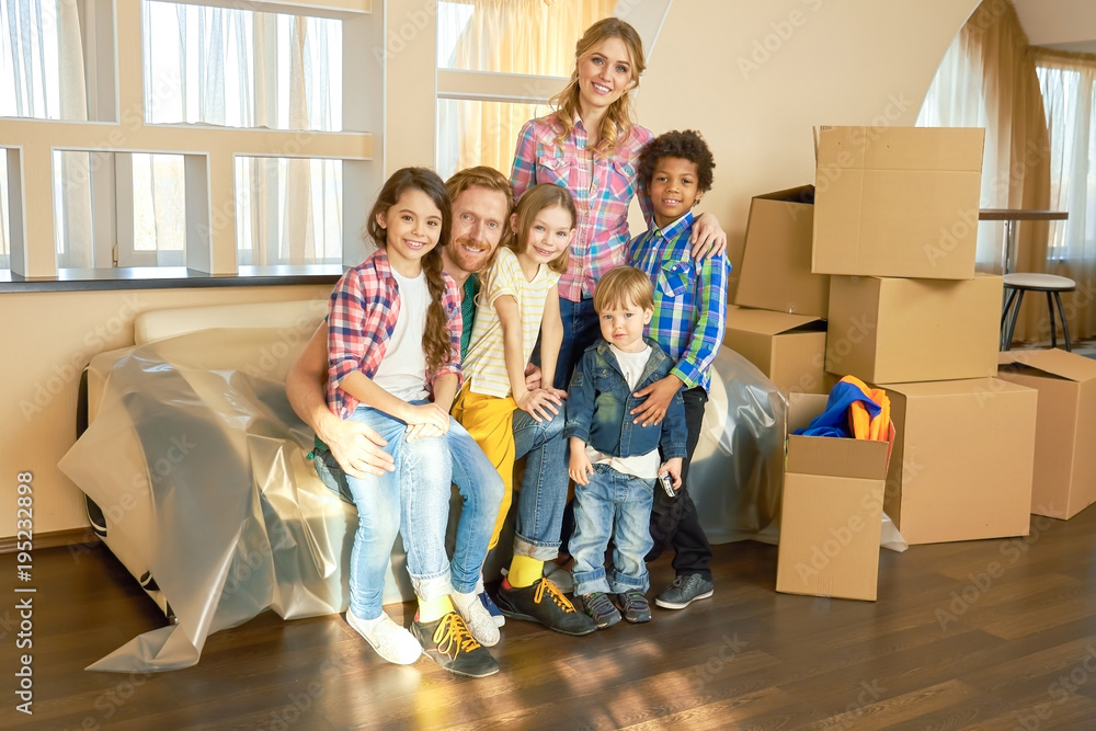 Happy family, relocation. Smiling people and carton boxes. Happy family, relocation. Smiling people and carton boxes.