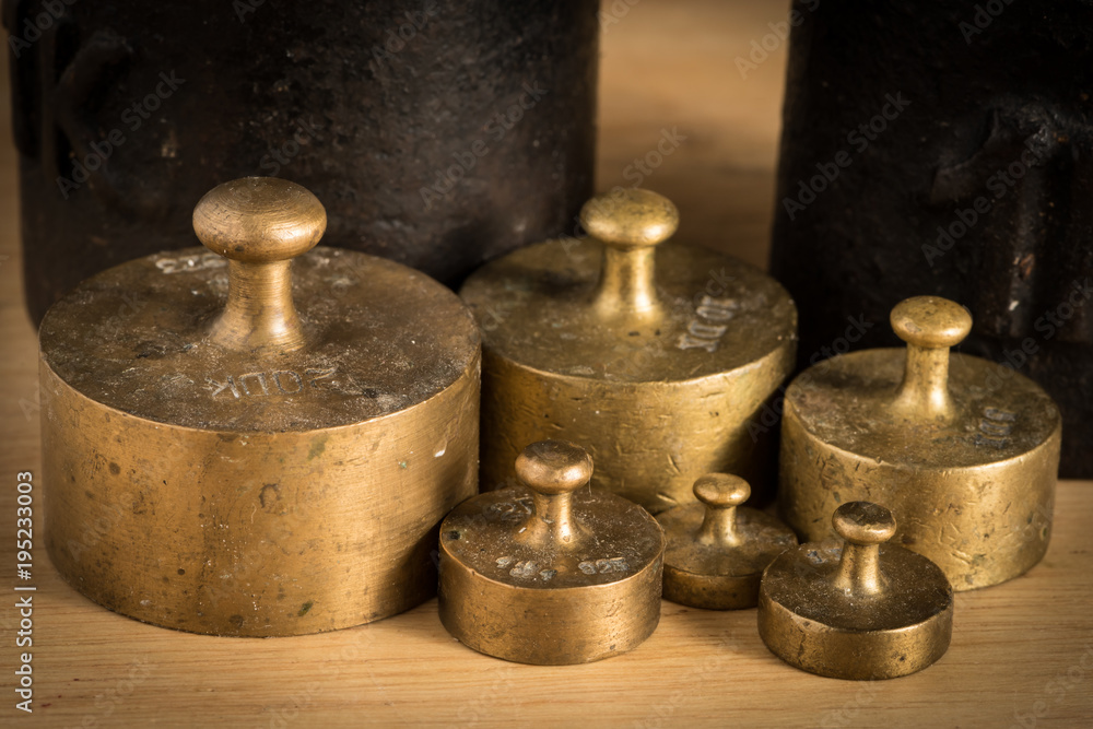Old iron 1kg weight and smaller brass weights for a kitchen scale Old iron 1kg weight and smaller brass weights for a kitchen scale
