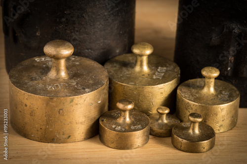 Old iron 1kg weight and smaller brass weights for a kitchen scale