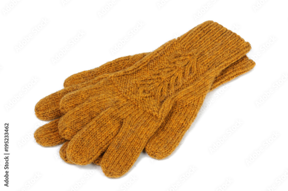 Fototapeta premium Yellow knitted gloves on a white background. View from above.