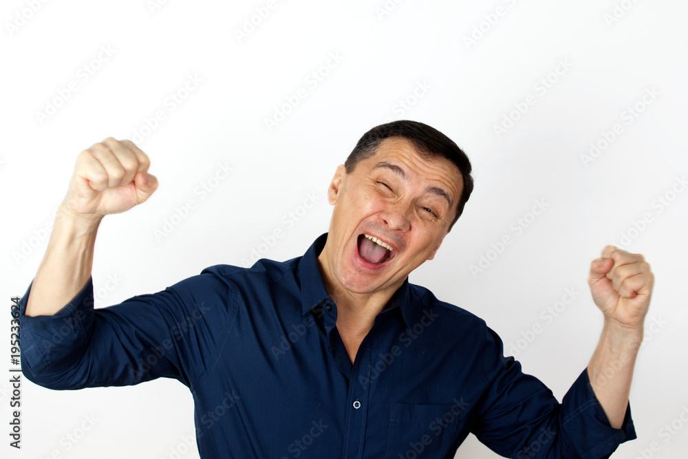 Portrait of a happy young woman clenches his fists being champion and successful person. Happiness concept Portrait of a happy young woman clenches his fists being champion and successful person. Happiness concept