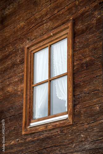Window on a wooden wall