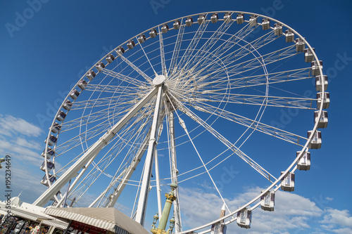Ferris wheel Roue de Paris at Place de la Concorde. Sunny day. Travel to famous landmarks