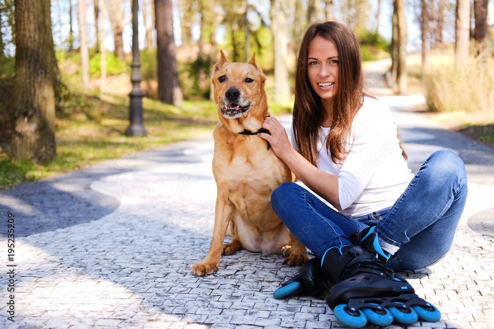Outdoors lifestyle portrait of a beautiful girl wearing roller s Outdoors lifestyle portrait of a beautiful girl wearing roller s
