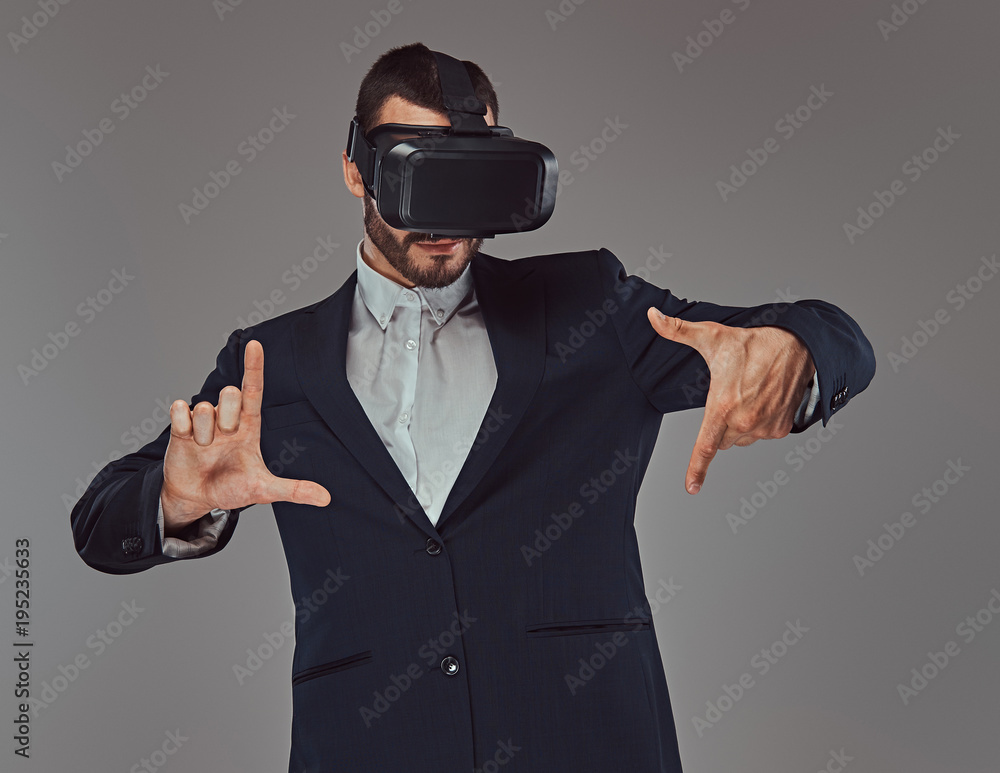 Studio portrait of a bearded businessman wearing a formal suit w Studio portrait of a bearded businessman wearing a formal suit w