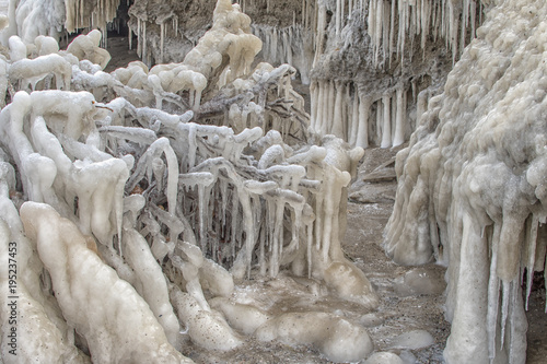 Magic isc sculptures at the beach , on a frosty winter day. - Frozen Ocean ice formations at the Baltic Sea photo