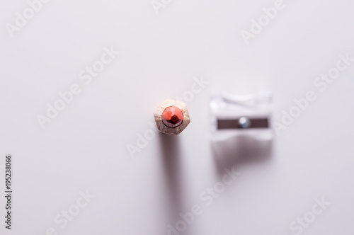 Red pencil and sharpener. Pencil and sharpener  isolated on a white background.  