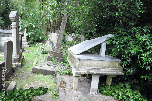 Old cemetary England. In Highgate, London you will find this fairy tale memorial with its overgrown tombstones. photo