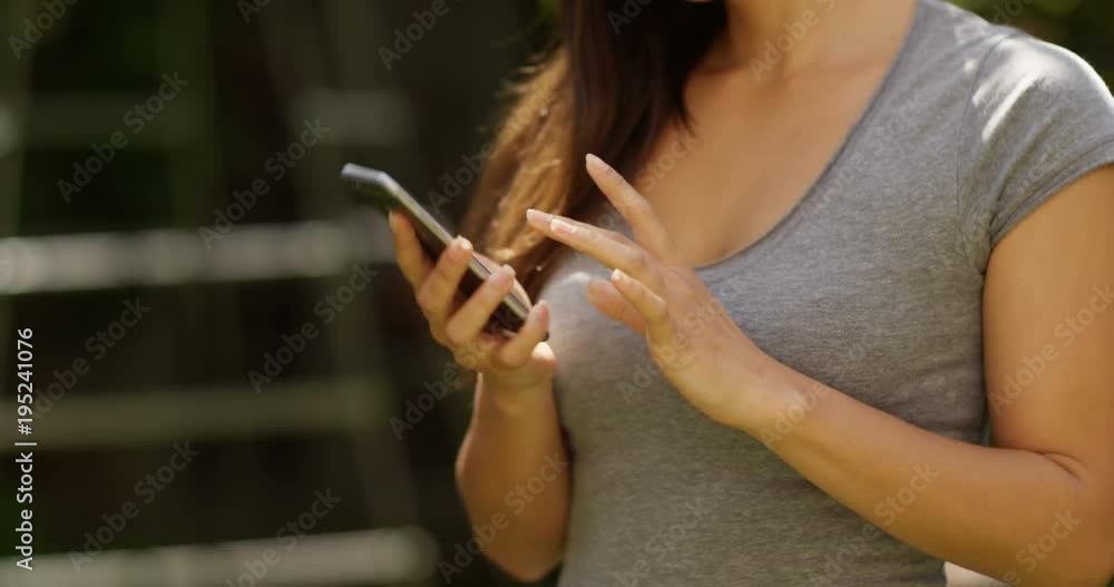 4K Closeup beautiful Hispanic woman talking on cell phone outdoors on a sunny day. Slow motion. 4K Closeup beautiful Hispanic woman talking on cell phone outdoors on a sunny day. Slow motion.