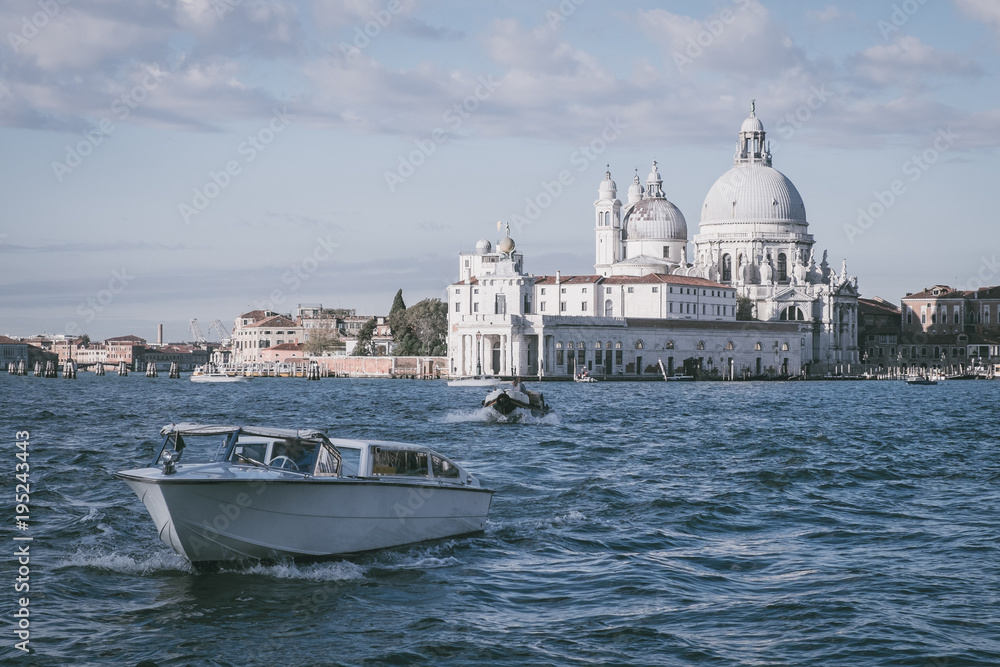 Basilica di Santa Maria della Salute, Background Venice in Italy with boats and church Salute, Basilica Salute with a ship in Venice