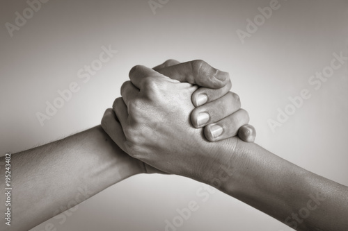Hands coming together, helping hand. People working together, unity, agreement.
 photo