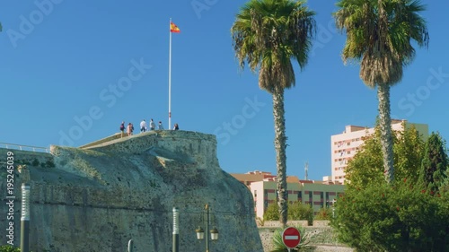 View of border fence of San Francisco Javier and tourists on viewing point in Ceuta