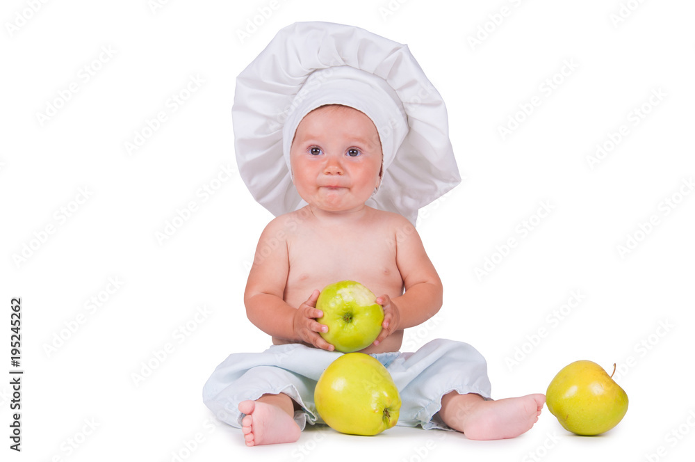 Cheerful little child with apples in hands in a chef suit on a white background. Cheerful little child with apples in hands in a chef suit on a white background.