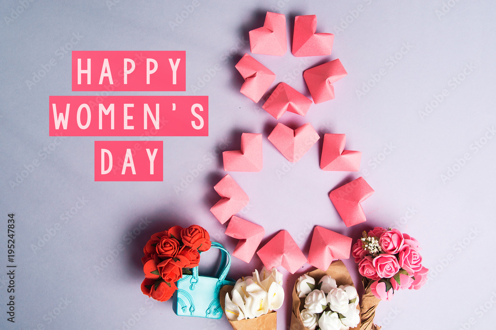 Happy International Women’s Day celebrate on March 8, congratulatory CARD. rose-color paper hearts shape figure eight 8 on purple background Happy International Women’s Day celebrate on March 8, congratulatory CARD. rose-color paper hearts shape figure eight 8 on purple background