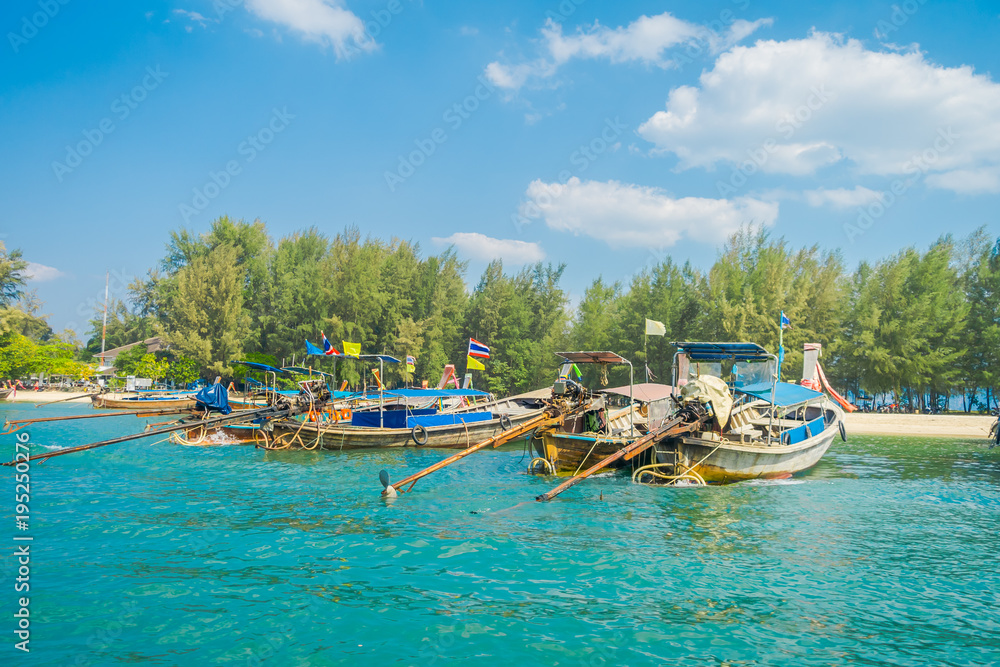 Obraz premium Outdoor view of Fishing thai boats in a row in Po-da island, Krabi Province, Andaman Sea, South of Thailand