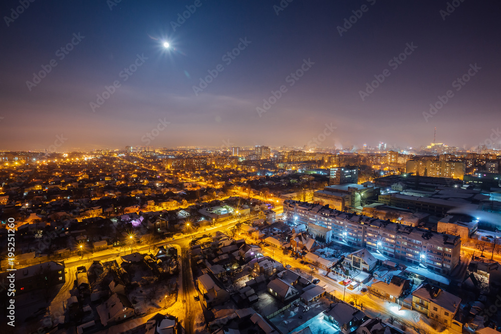 Night Voronezh aerial cityscape from rooftop. Residential area. Moon above city
