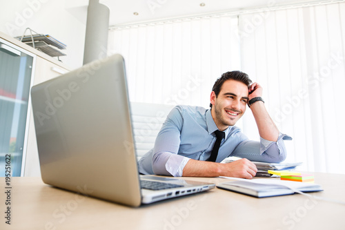 фотографія Lonley tiresome businessman spending time at work