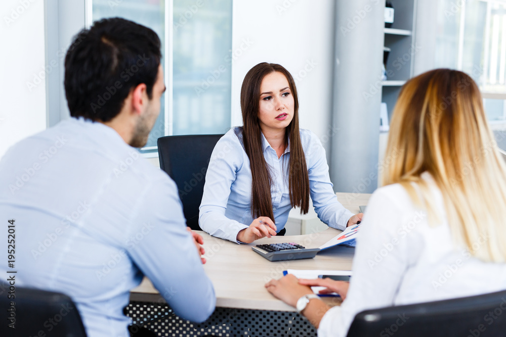 Fototapeta premium Young business team talking about something