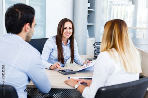 Wallpaper Mural Young bankers analysing financial report Torontodigital.ca