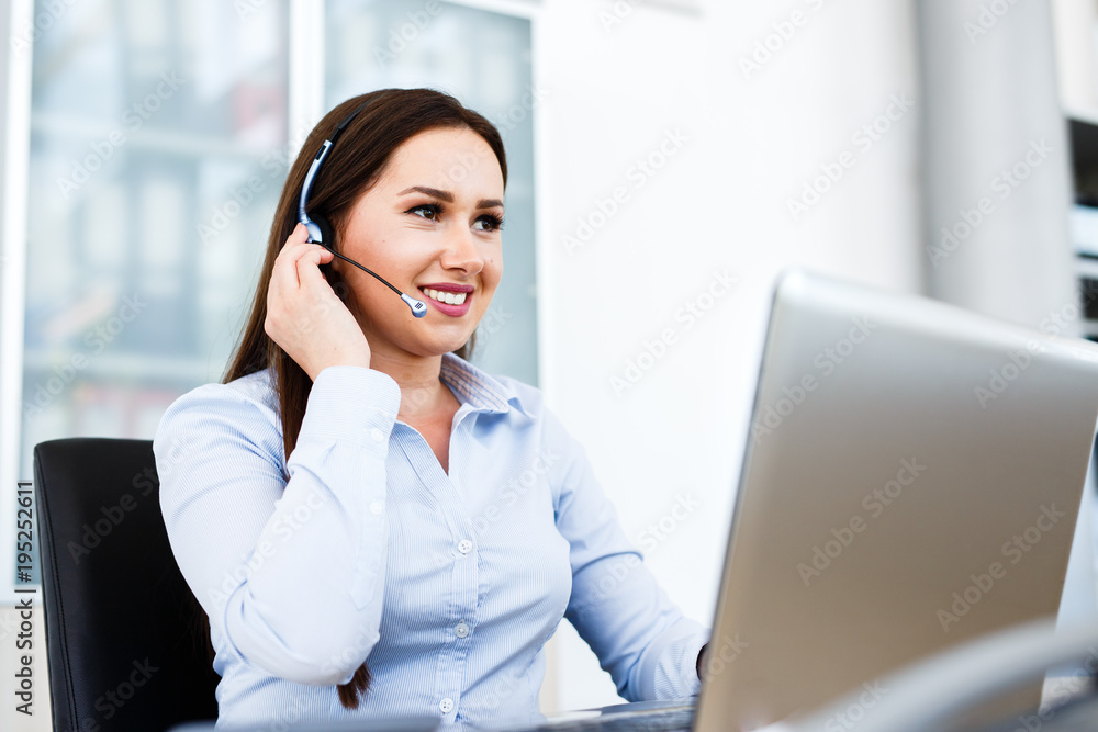 Beautiful young woman working at call center Beautiful young woman working at call center