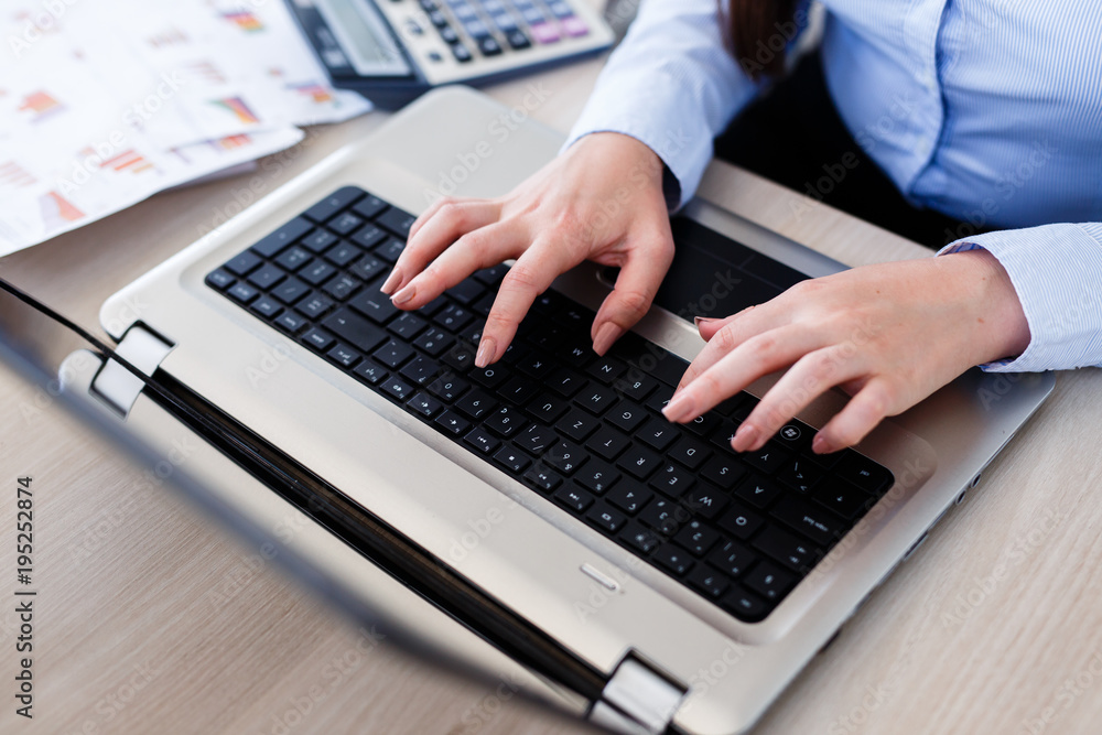 Young female statistician inputting data Young female statistician inputting data