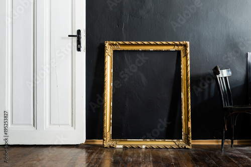 Door and frame in black interior photo