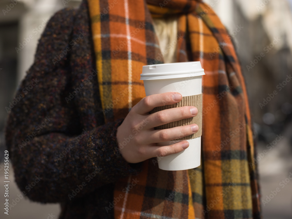 Woman in coat with coffee Woman in coat with coffee