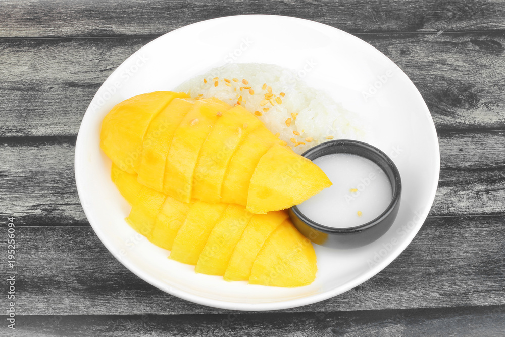 Ripe golden mango with green and white of sticky rice. Ripe golden mango with green and white of sticky rice.