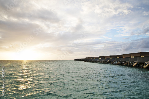 Over water bungalows at sunset