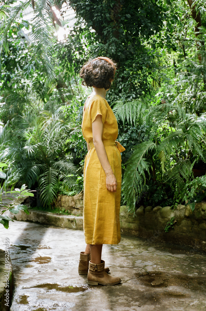 Woman standing in tropic forest Woman standing in tropic forest