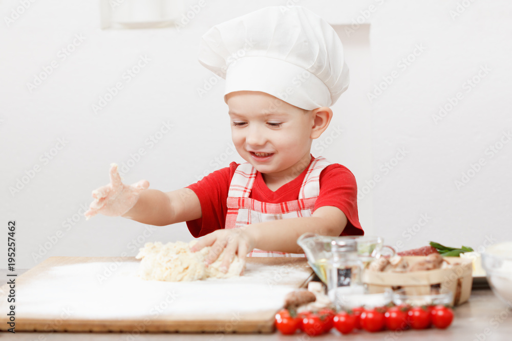 cooking pizza is fun - little chef playing with flour cooking pizza is fun - little chef playing with flour