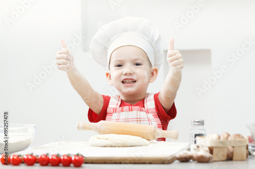 Boy with chef hat preparing...