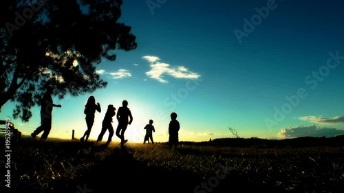 Silhouette of a family playing