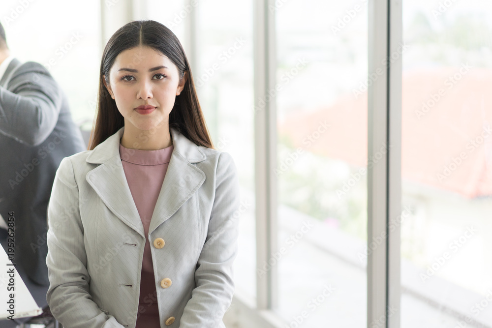 Business beauty woman wearing suit, looking project. Open space loft office. Panoramic windows background.She happy and smile. Business beauty woman wearing suit, looking project. Open space loft office. Panoramic windows background.She happy and smile.