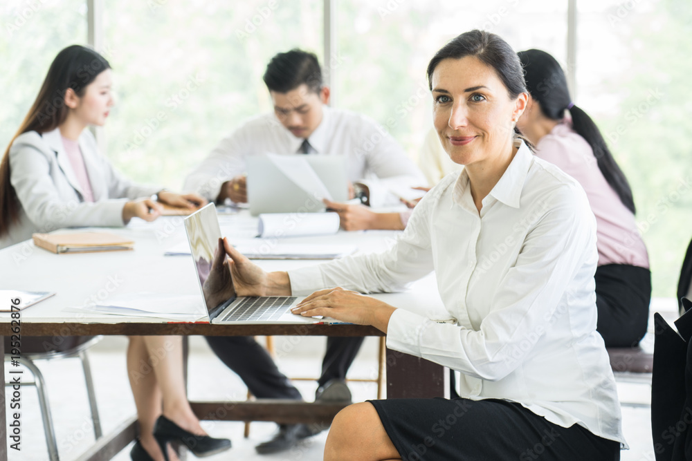 Happy Businesswoman Standing In Front Of meeting project. Happy Businesswoman Standing In Front Of meeting project.