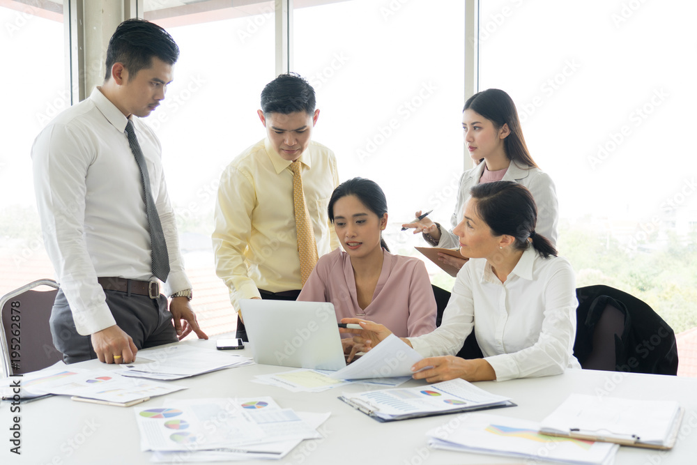 Happy business people cheering and showing thumb up at office. Happy time in the office.