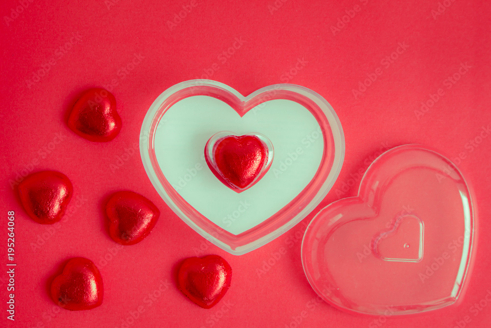 Red background with heart rests in the concept of Valentine's Day.