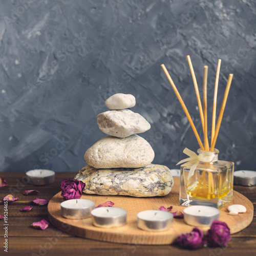 Spa composition-stones  candles  aromatherapy  dry flowers.