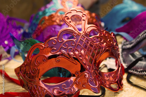 colorful beautiful masks on the table © Igorzvencom