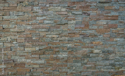 Stack pattern of stone wall background.