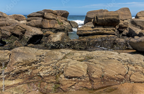 Patterns and Textures on Rocks on Beach Background