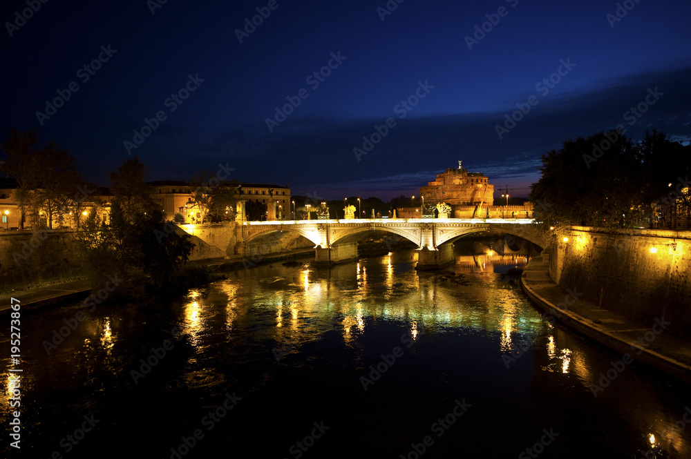 Roman Bridge over River at Night