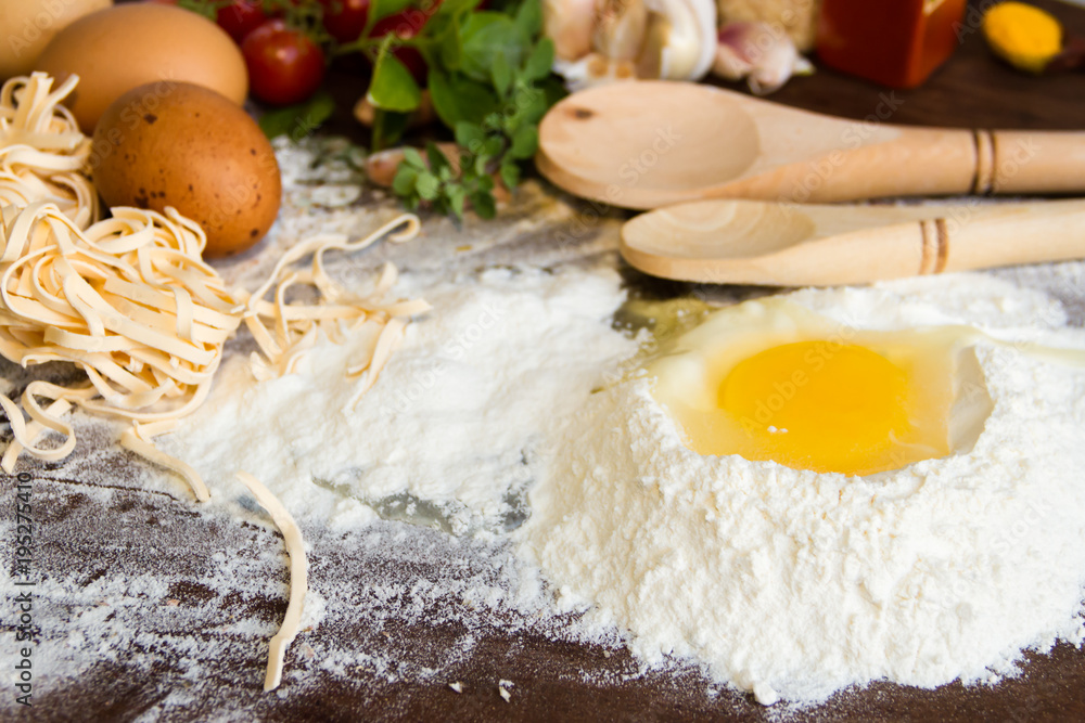 ingredients preparation spaghetti with eggs, tomatoes herbs and spices ingredients preparation spaghetti with eggs, tomatoes herbs and spices