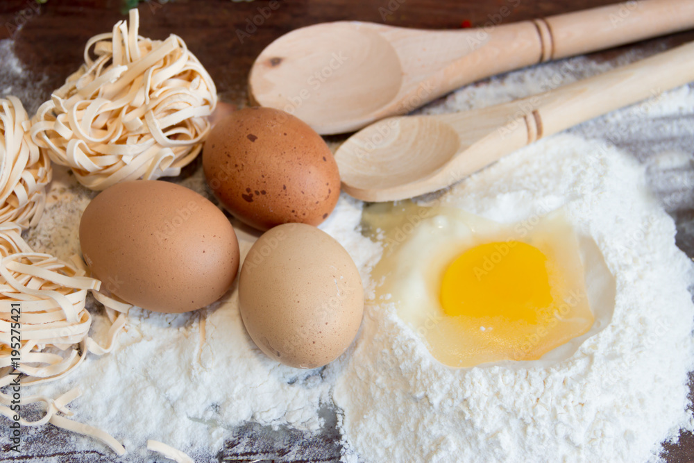 ingredients preparation spaghetti with eggs, tomatoes herbs and spices ingredients preparation spaghetti with eggs, tomatoes herbs and spices